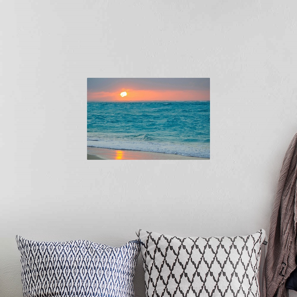 A bohemian room featuring From the National Geographic Collection, a photo canvas of choppy ocean waves crashing onto a tro...
