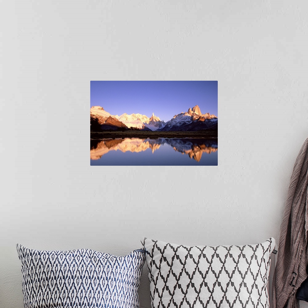 A bohemian room featuring Cerro Torre, centre, and Mount FitzRoy, right, Cerro Solo, left, at dawn famous peaks on edge of ...