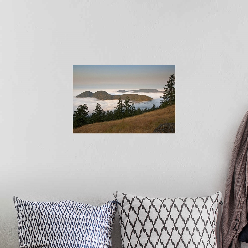 A bohemian room featuring Entrance Mountain and Mount Woolard emerge from sea fog around Orcas Island as seen from Mt. Cons...