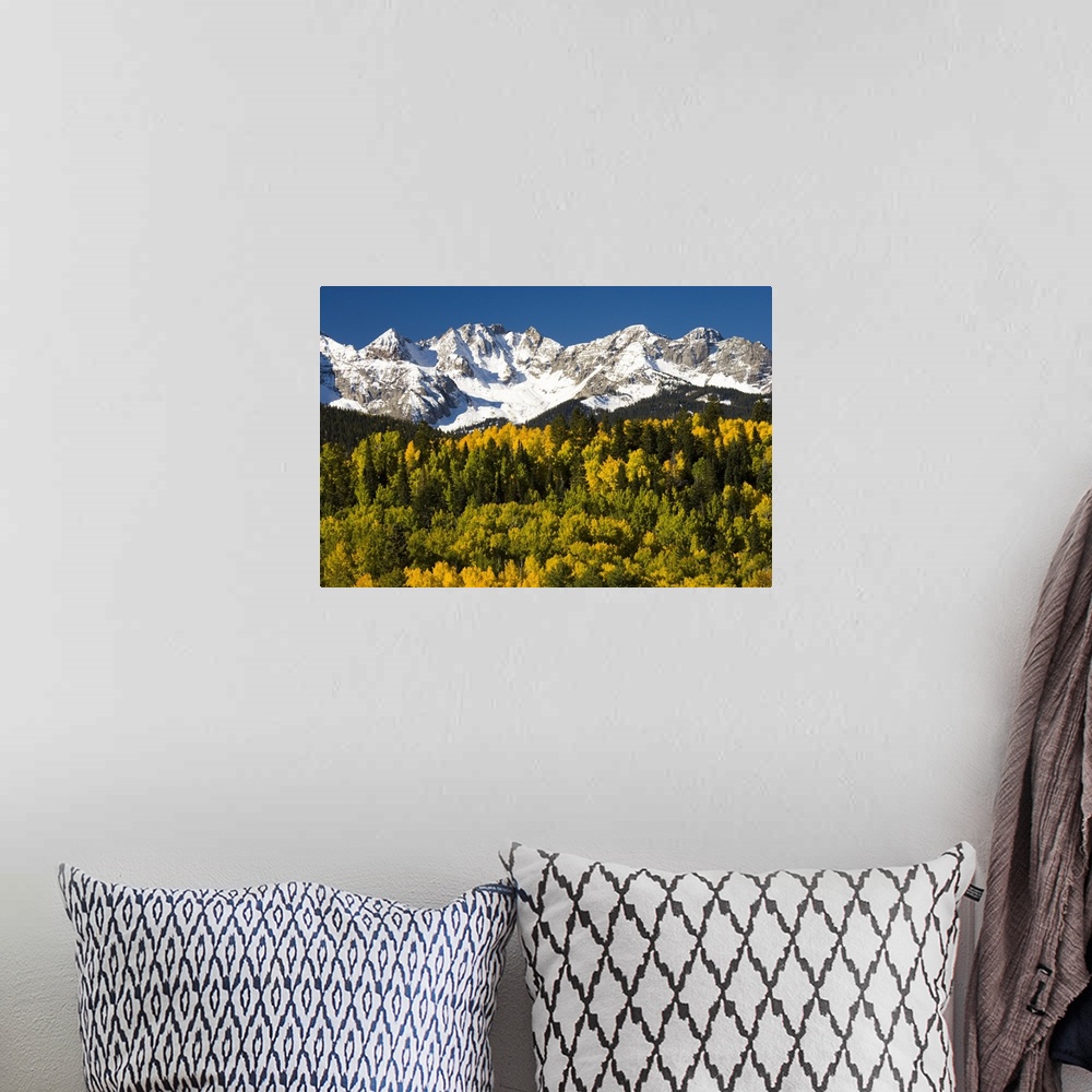 A bohemian room featuring Fall colors and snow covered peaks, North America