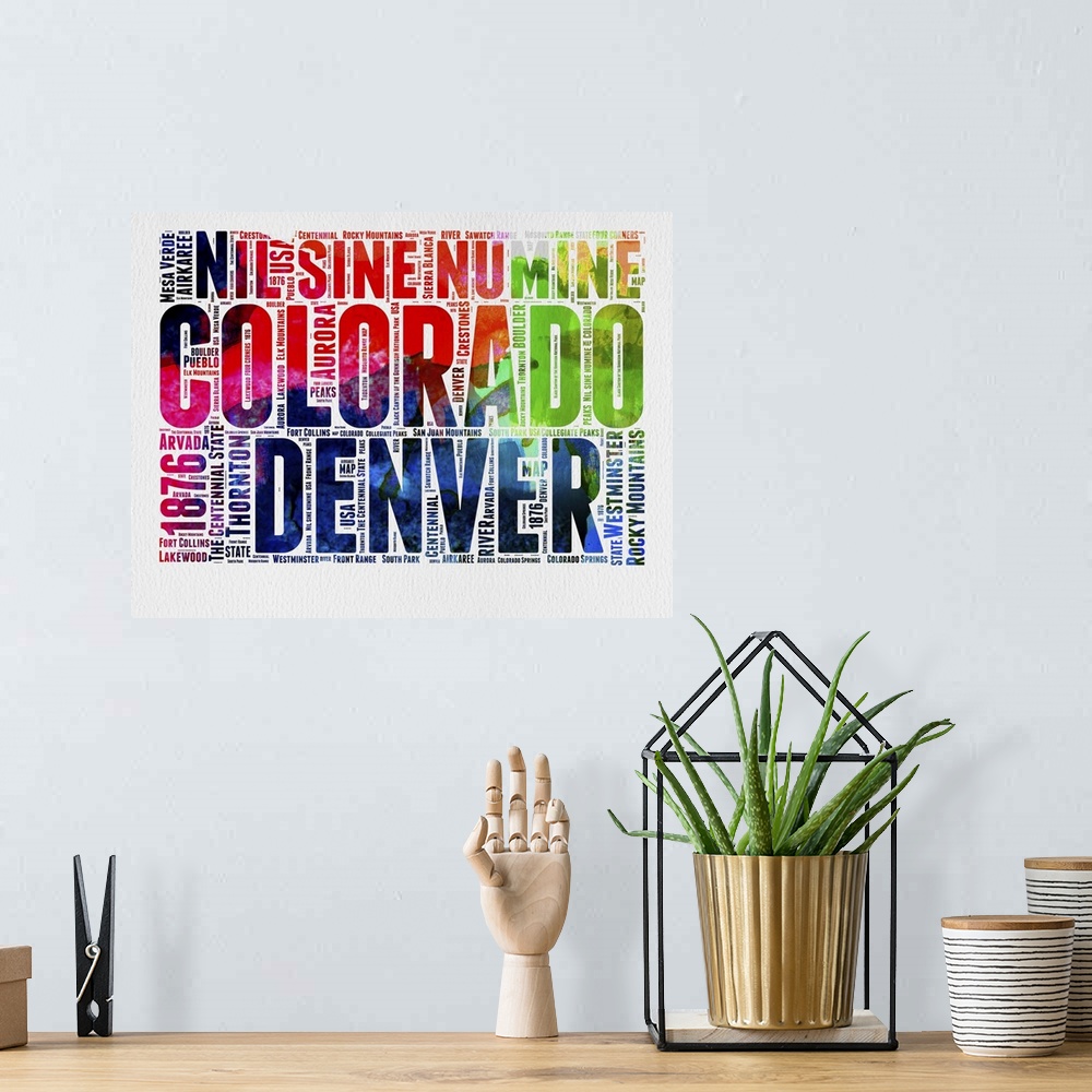 A bohemian room featuring Watercolor typography art map of the US state Colorado.
