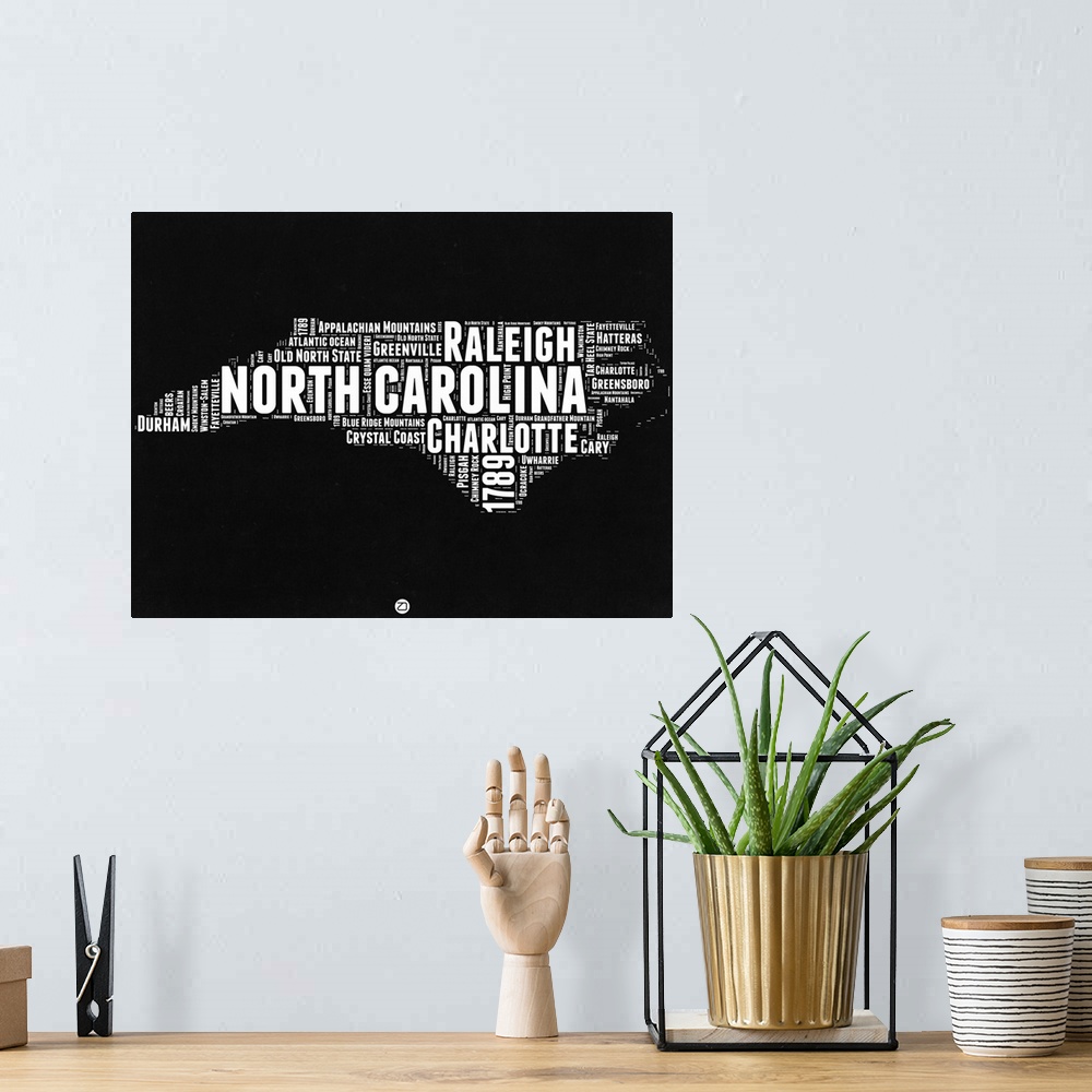 A bohemian room featuring Typography art map of the US state North Carolina.