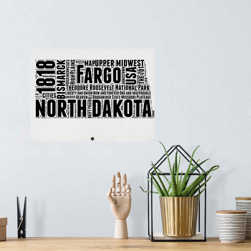 A bohemian room featuring Black and white art map of the US state  North Dakota.