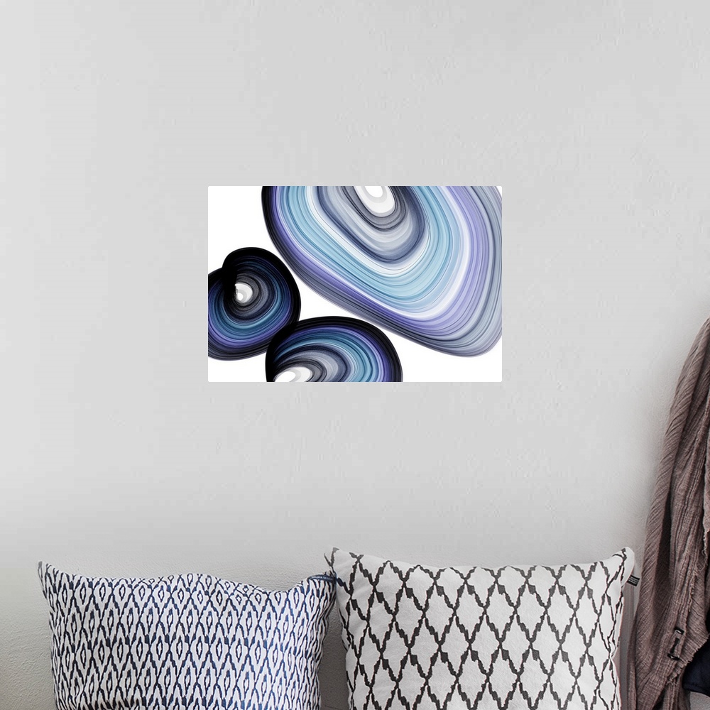 A bohemian room featuring Abstract artwork created by spiraling, swirling lines leaving behind blue trails.