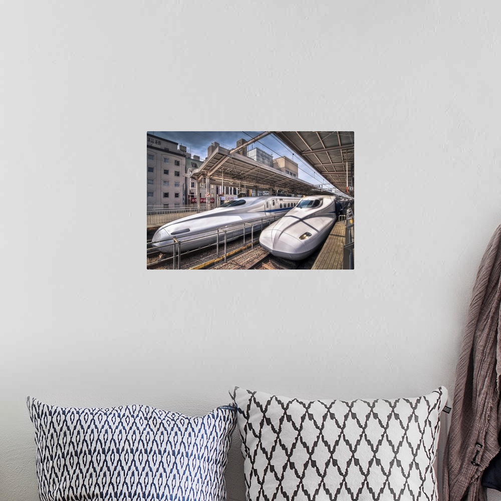 A bohemian room featuring HDR photograph of two bullet trains stopped at a station in Japan.