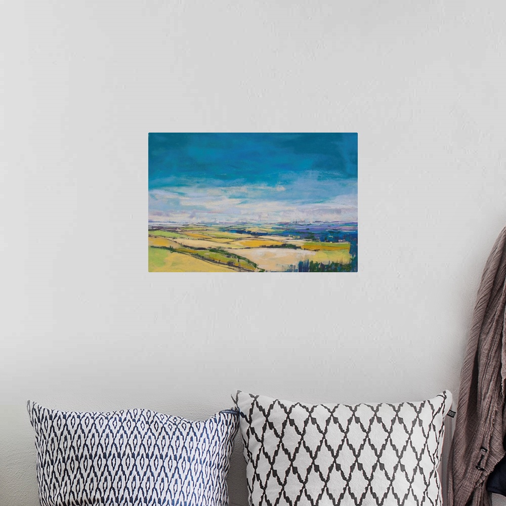 A bohemian room featuring Pastel landscape painting of English countryside with trees and fields.