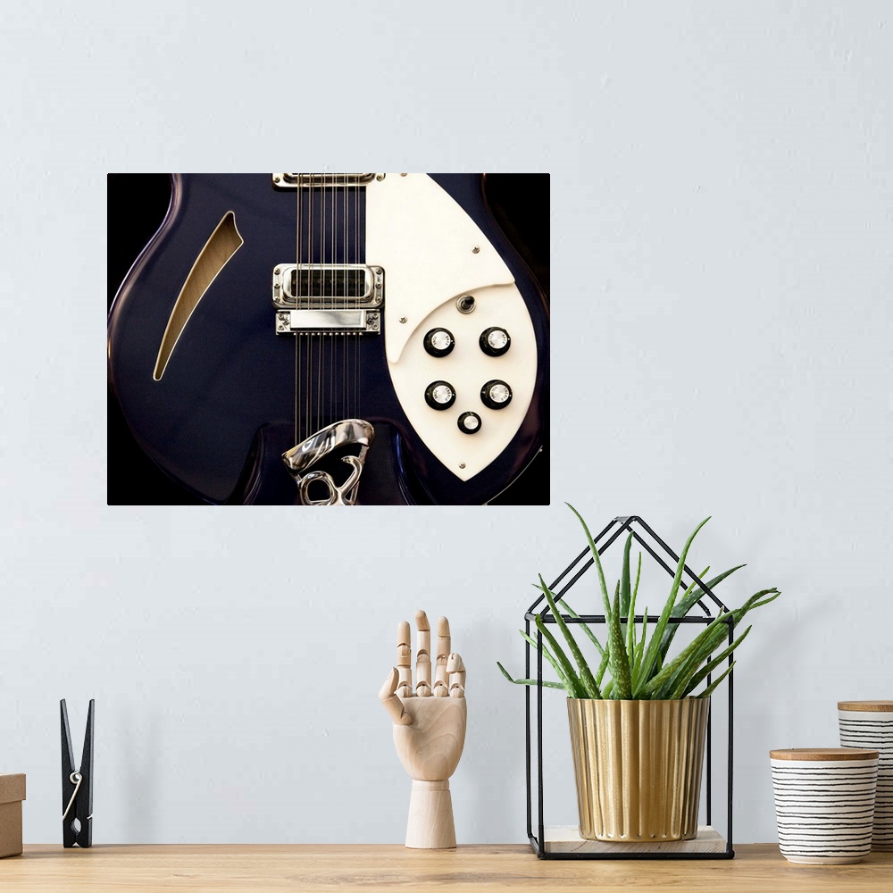 A bohemian room featuring Close-up photograph of an electric guitar.