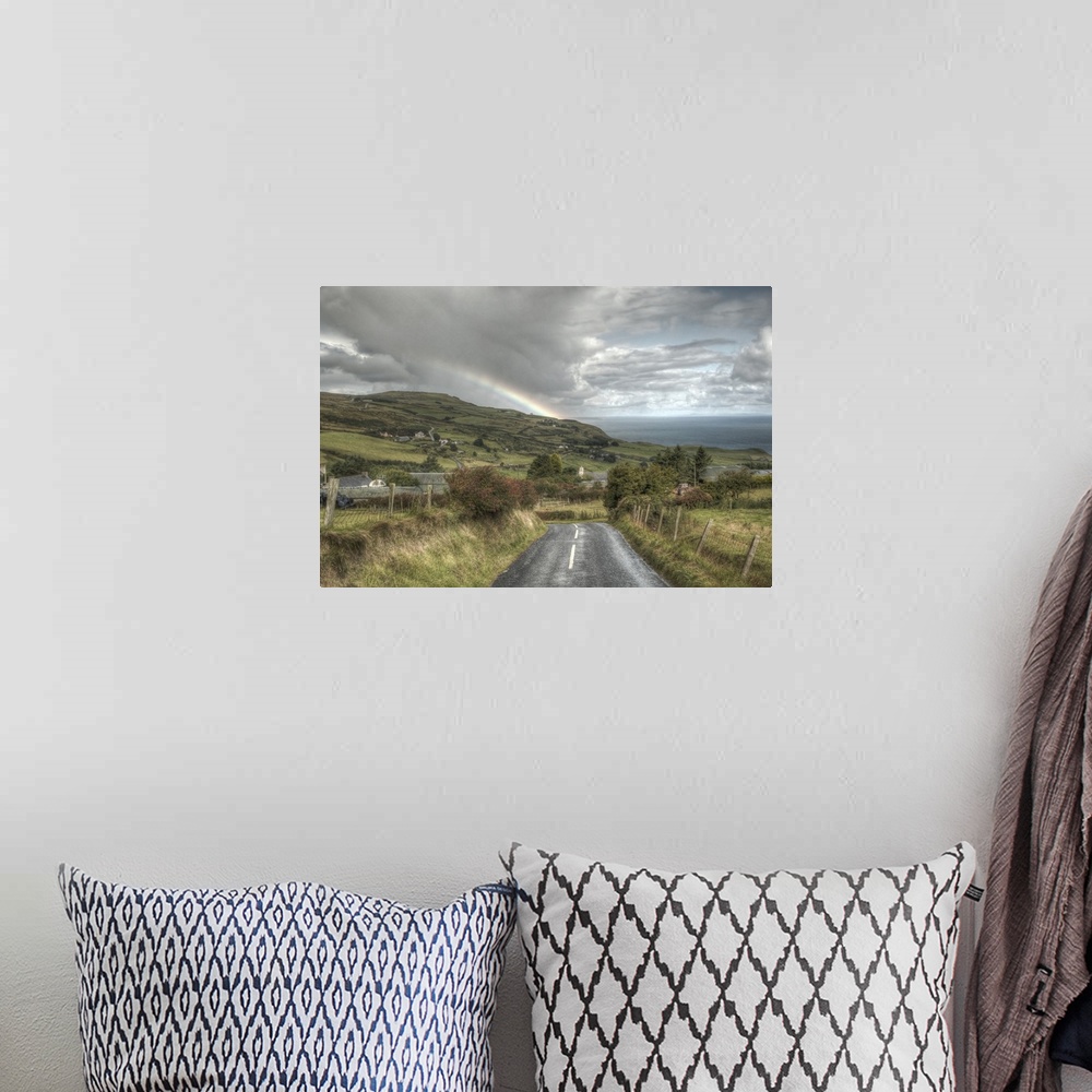A bohemian room featuring A photograph looking down the road of a countryside landscape in Northern Ireland.