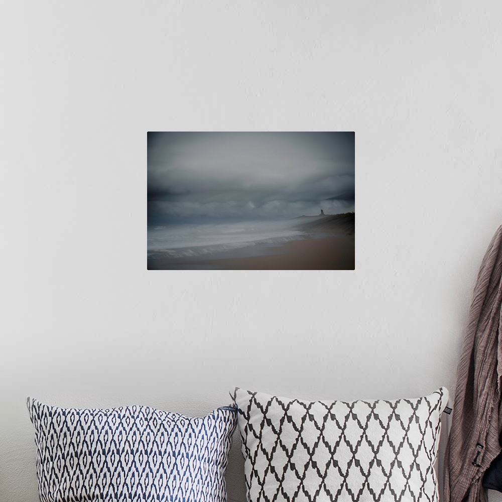 A bohemian room featuring Landscape photograph of the beach on an overcast day, created with multiple exposures.