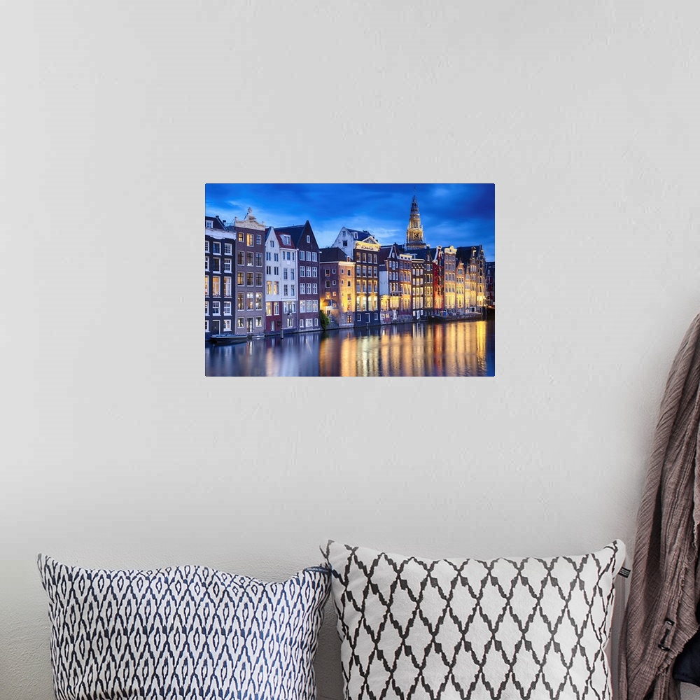 A bohemian room featuring Amsterdam Illuminated at Dusk with the Oude Church in The Background, North Holland, The Neherklands