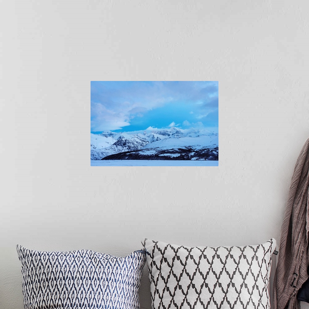 A bohemian room featuring Snowy mountains landscape on blue sky background in Iceland