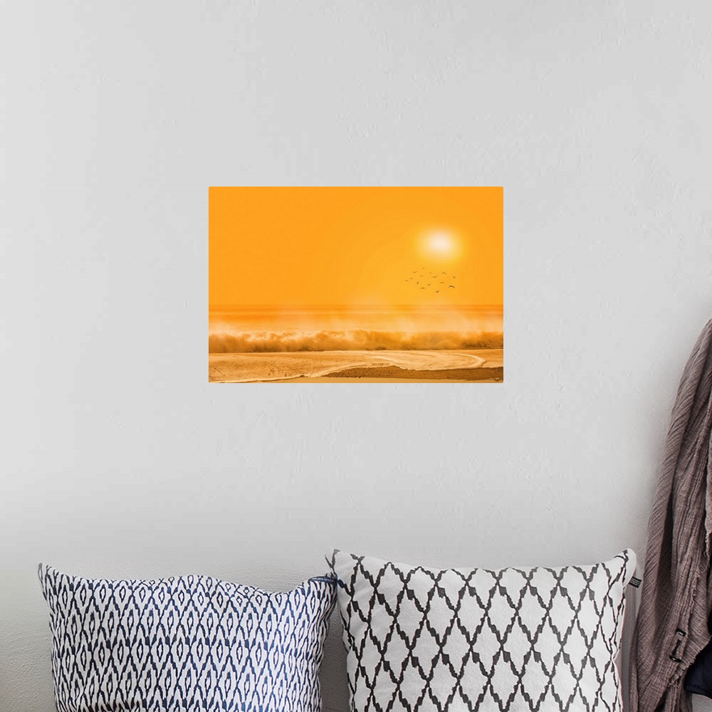 A bohemian room featuring A photograph of a beach scene under an orange sky.