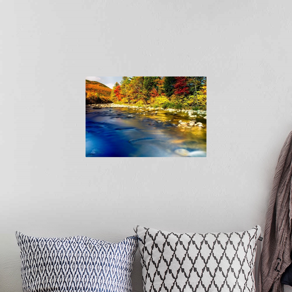 A bohemian room featuring Fine art photo of a clear river near a forest in the fall in New England.