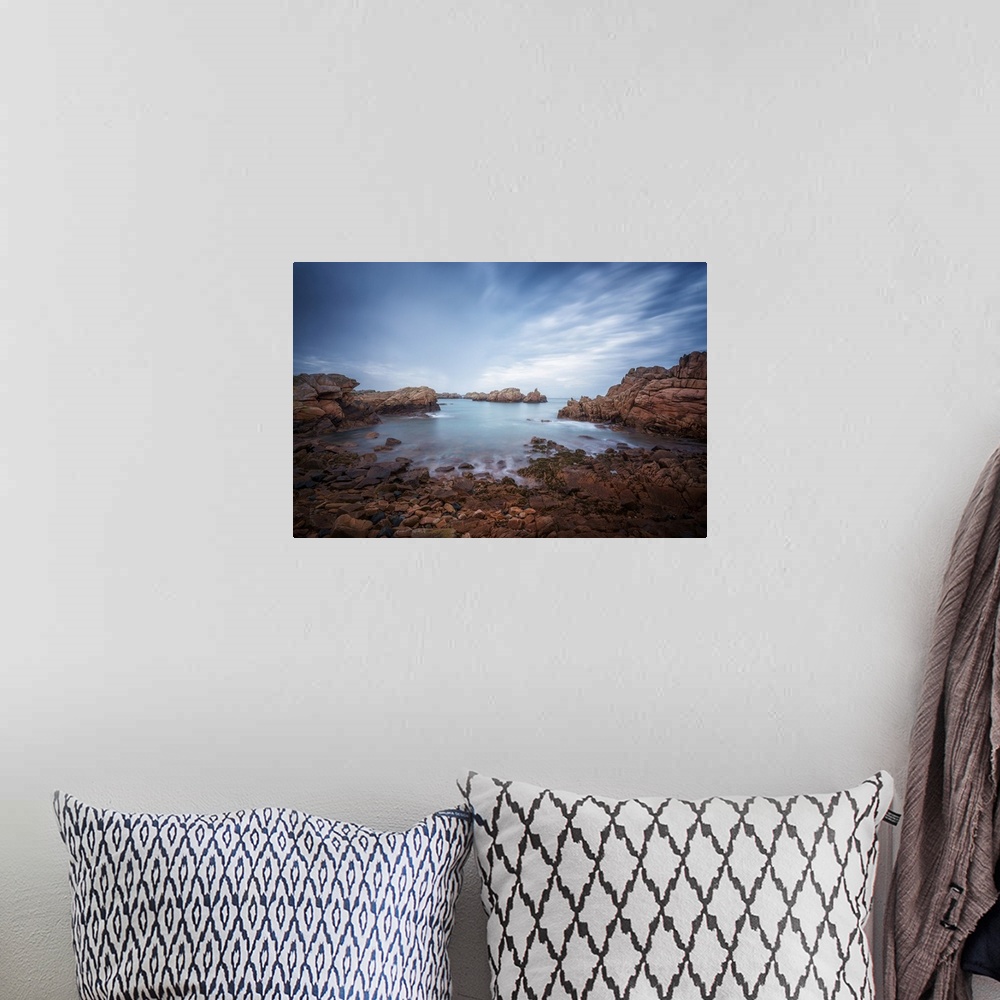 A bohemian room featuring Fine art photo of the rocky shoreline of an island in the north of France.
