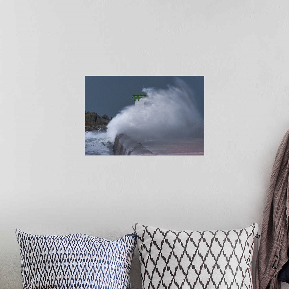A bohemian room featuring A spectacular photograph of a wave caught in mid-splash.