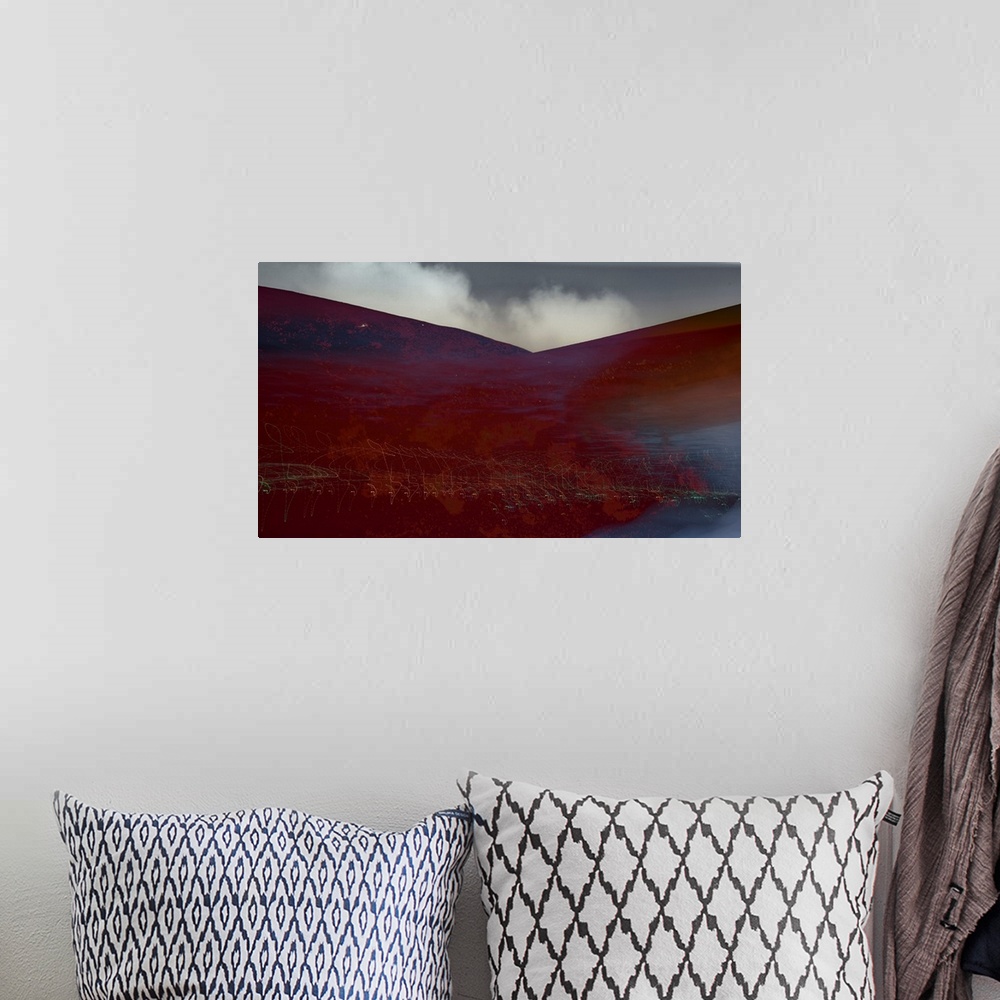 A bohemian room featuring Photograph of an abstract landscape with rusted red hills and light trails, created with multiple...