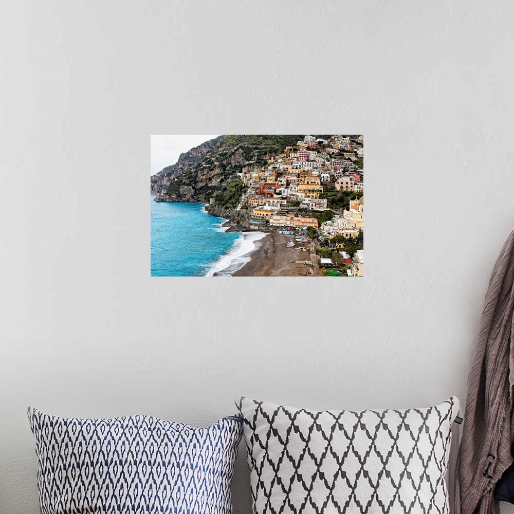 A bohemian room featuring High angle close up view of the beach and Town of Positano, Campania, Italy.