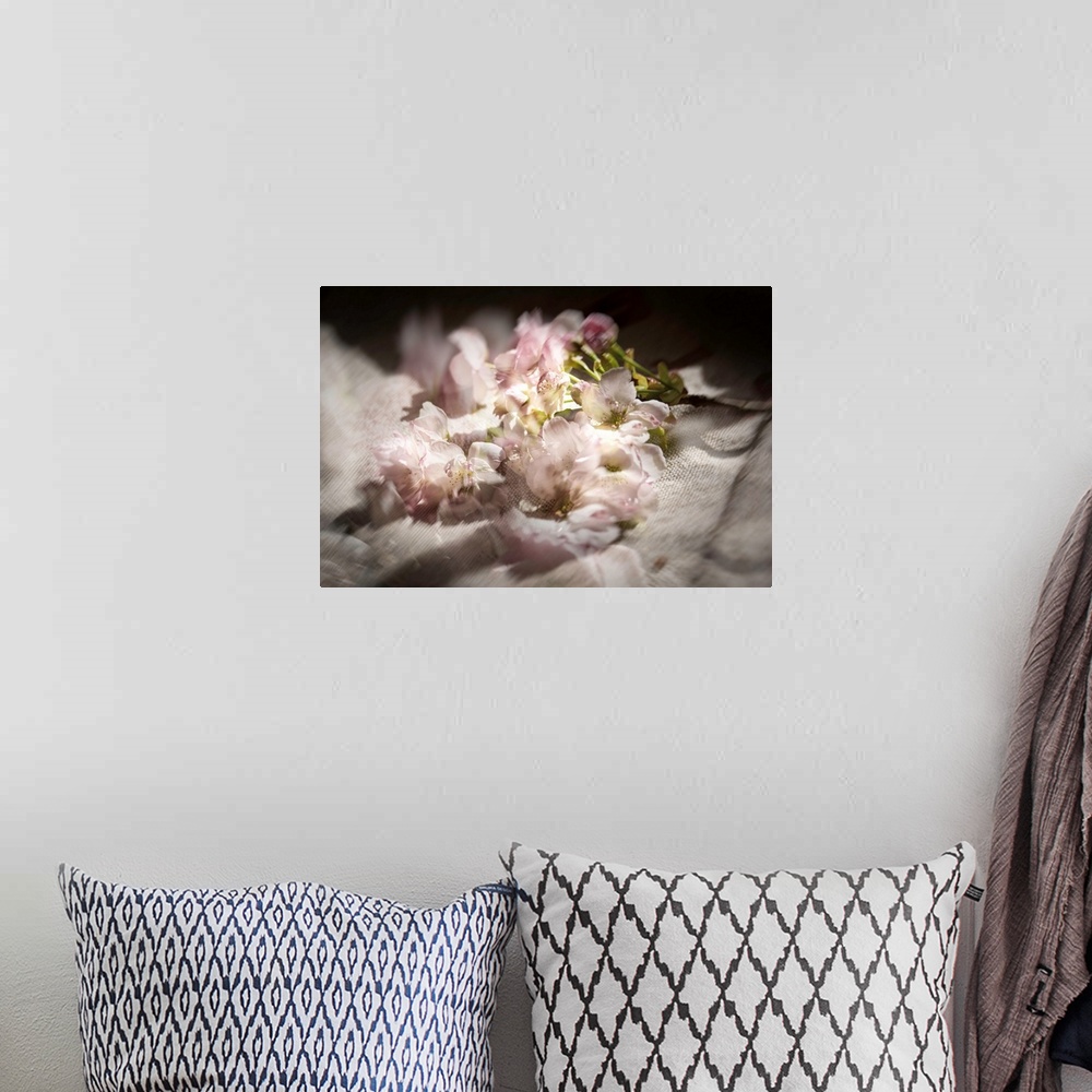 A bohemian room featuring Dreamy photograph of cherry blossom flowers on linen with multiple exposures.