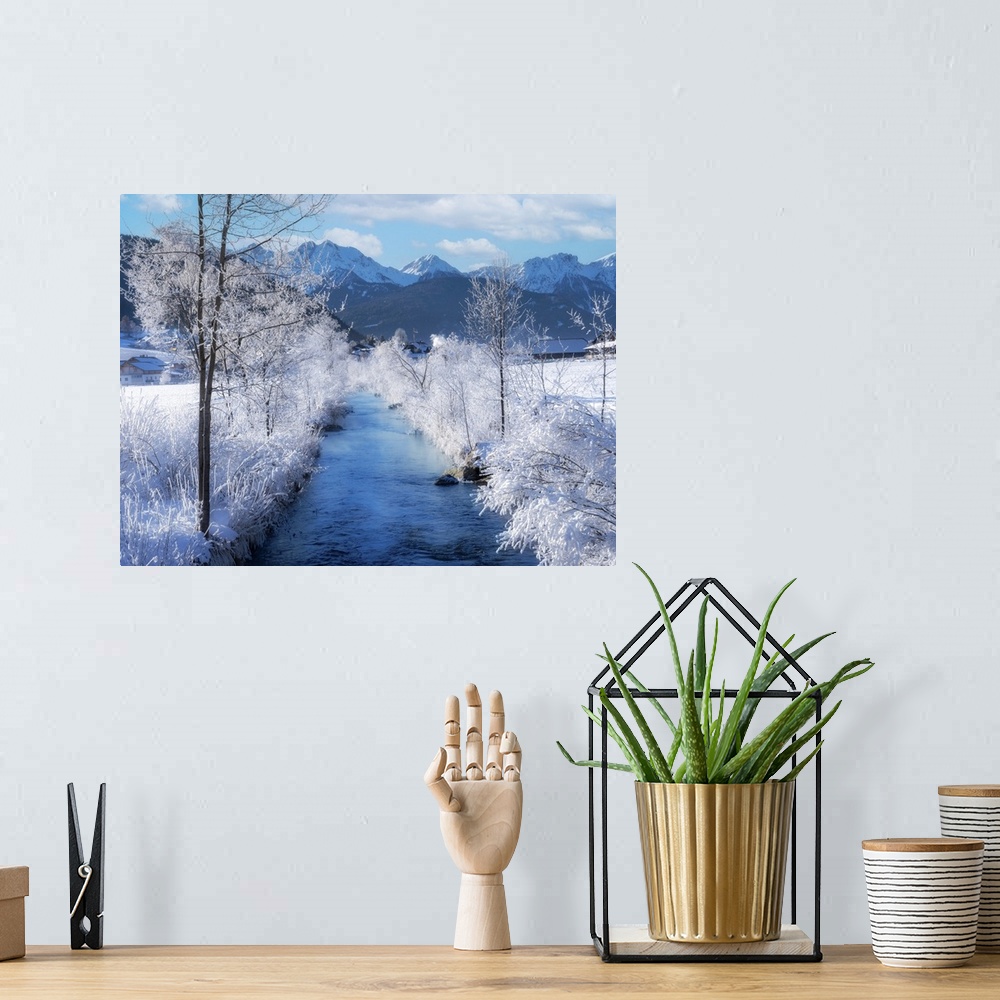 A bohemian room featuring I stopped to take a picture of this blue mountain river passing between completely snow-covered w...
