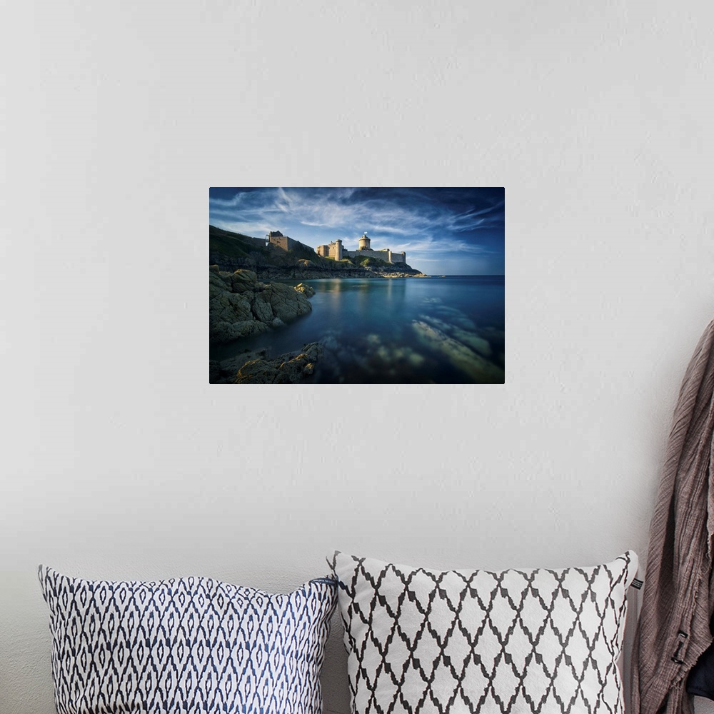 A bohemian room featuring Classical view of a castle facing the sea and the rock, the place of Fort la Latte, in Brittany i...