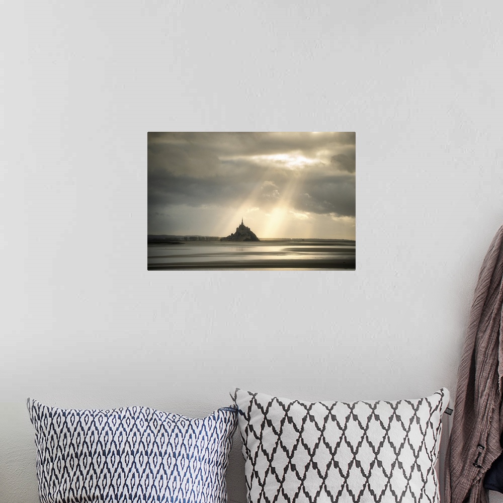 A bohemian room featuring Mont saint michel in normandy, France, before sunset! Sun rays passing throw the grey clouds givi...