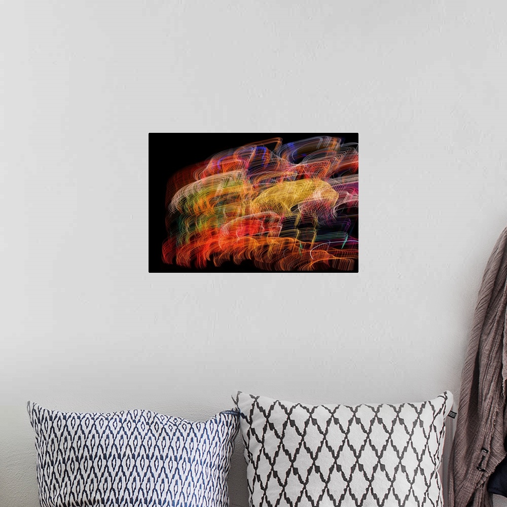 A bohemian room featuring Abstract image created by a long exposure of moving lights.
