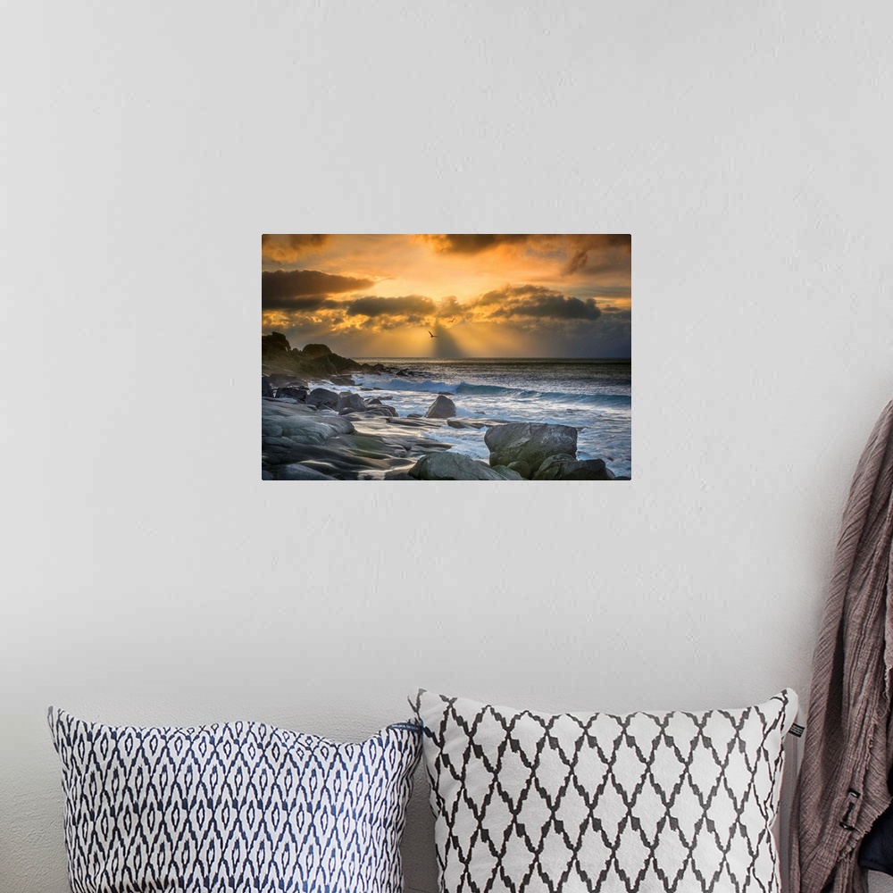 A bohemian room featuring Rocky coast of Lofoten, Norway, at sunset.