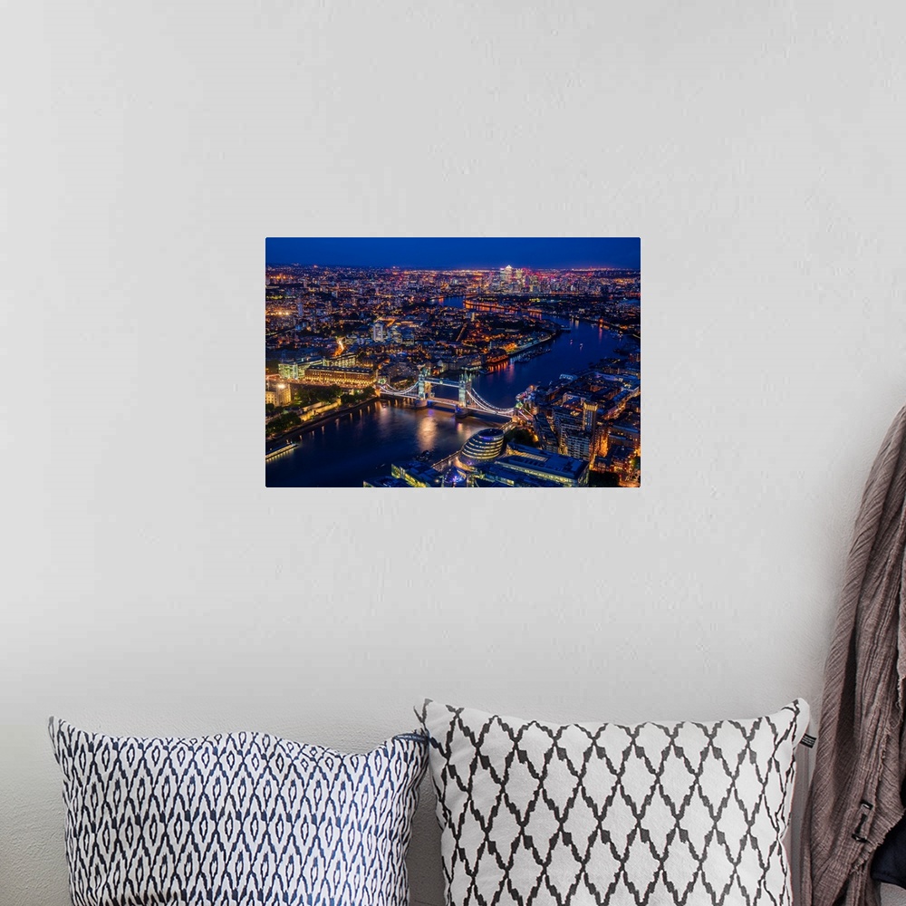 A bohemian room featuring Aerial photograph of Tower Bridge, River Thames, and the city of London lit up at night. View fro...