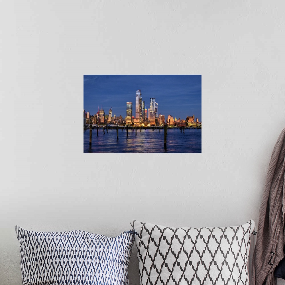 A bohemian room featuring Buildings of Midtown Manhattan Illuminated at Night as Viewed from Weehawken, New Jersey