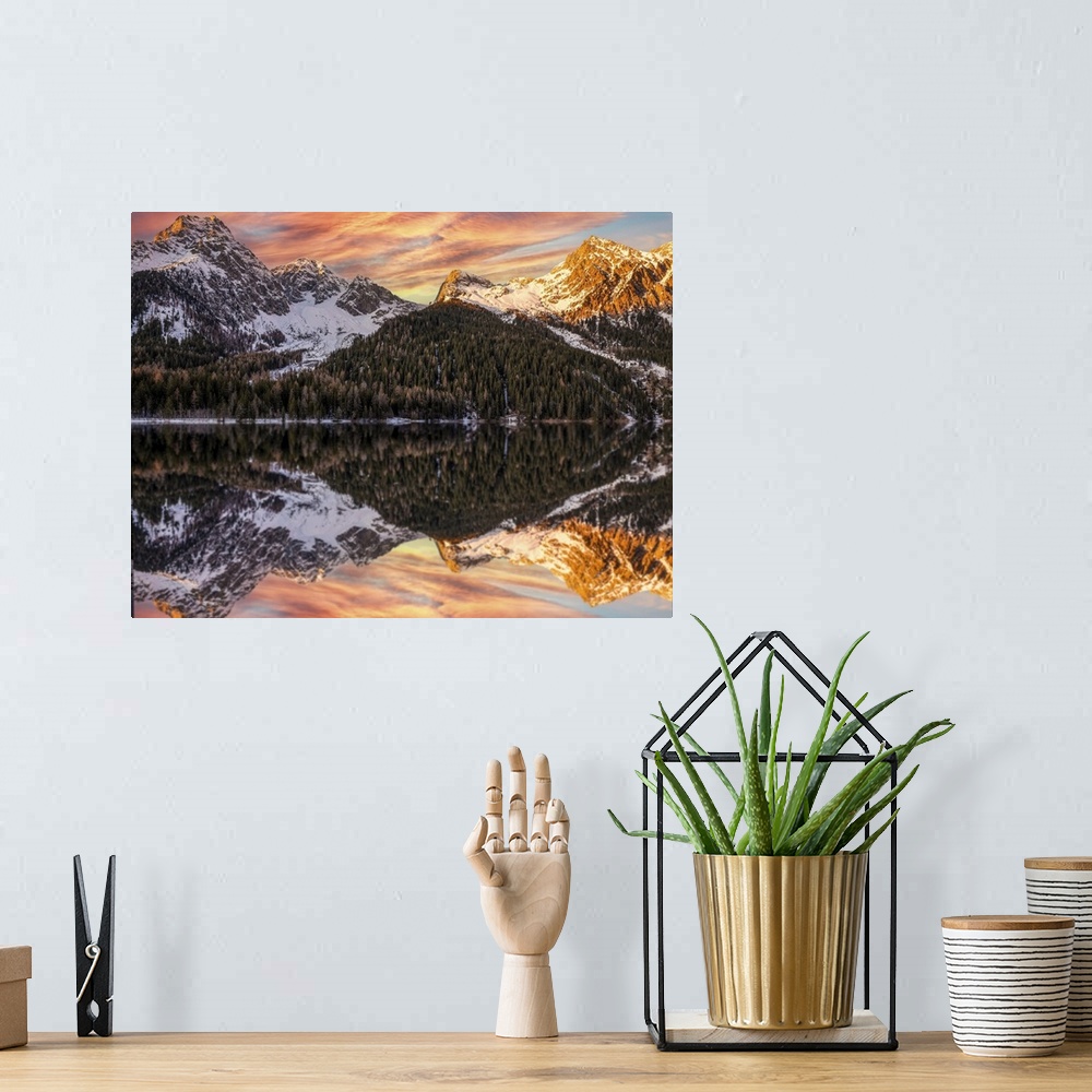 A bohemian room featuring An alpine landscape in the middle of Lake Anterselva after a heavy snowfall. The sunset with its ...
