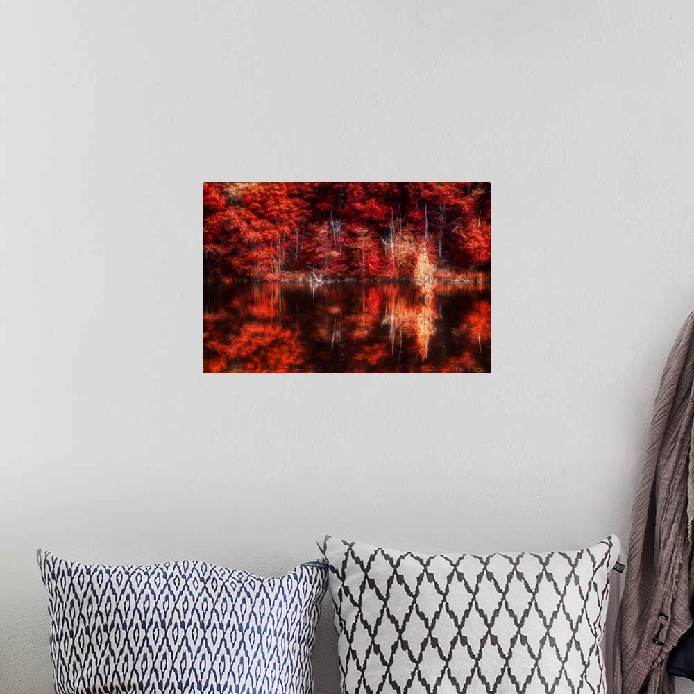 A bohemian room featuring Photo Expressionism - Fiery Red colored forest in autumn at the edge of a lake.