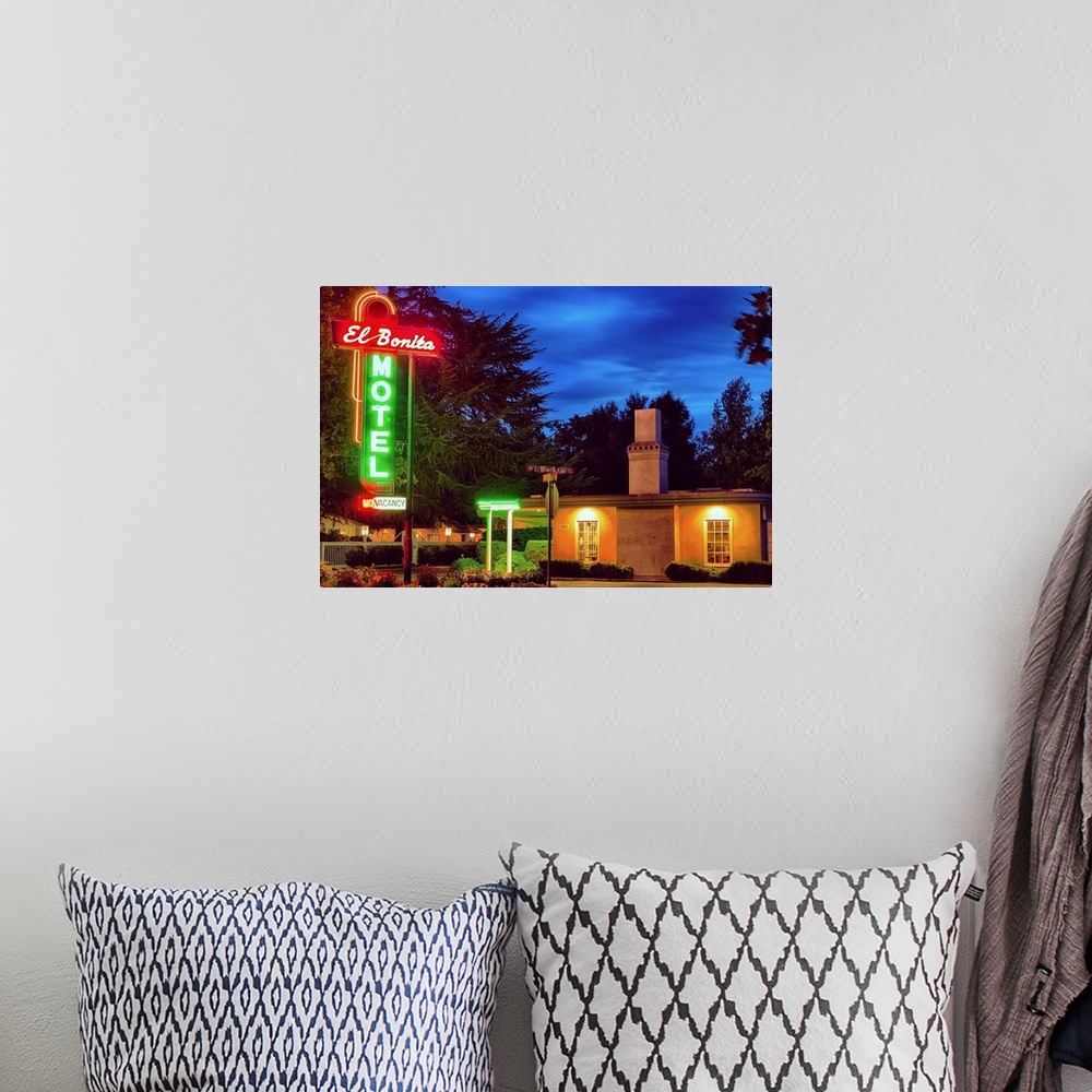 A bohemian room featuring Fine art photo of a motel in Napa Valley with bright neon signs.