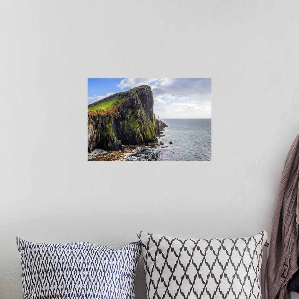 A bohemian room featuring Fine art photo of a rocky cliff overlooking the ocean.
