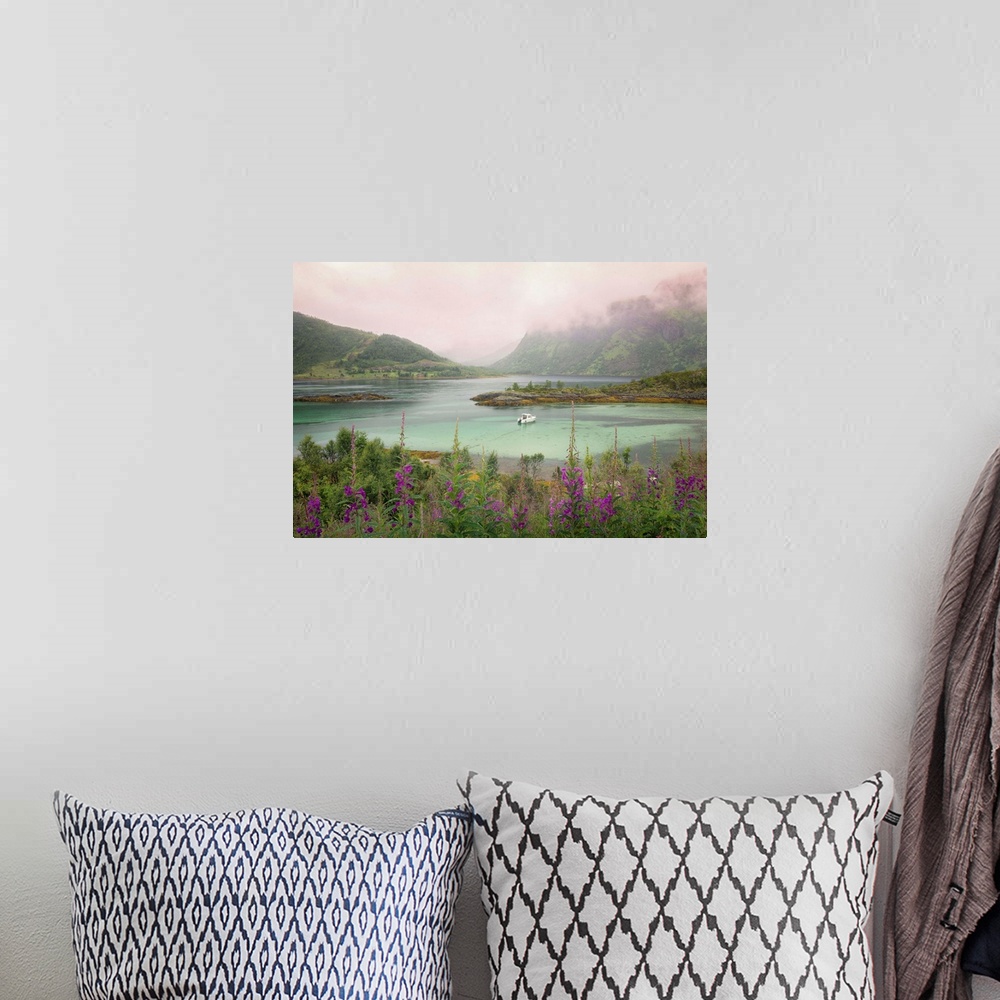 A bohemian room featuring A Norwegian lake below a mountain range under a blanket of thick clouds.
