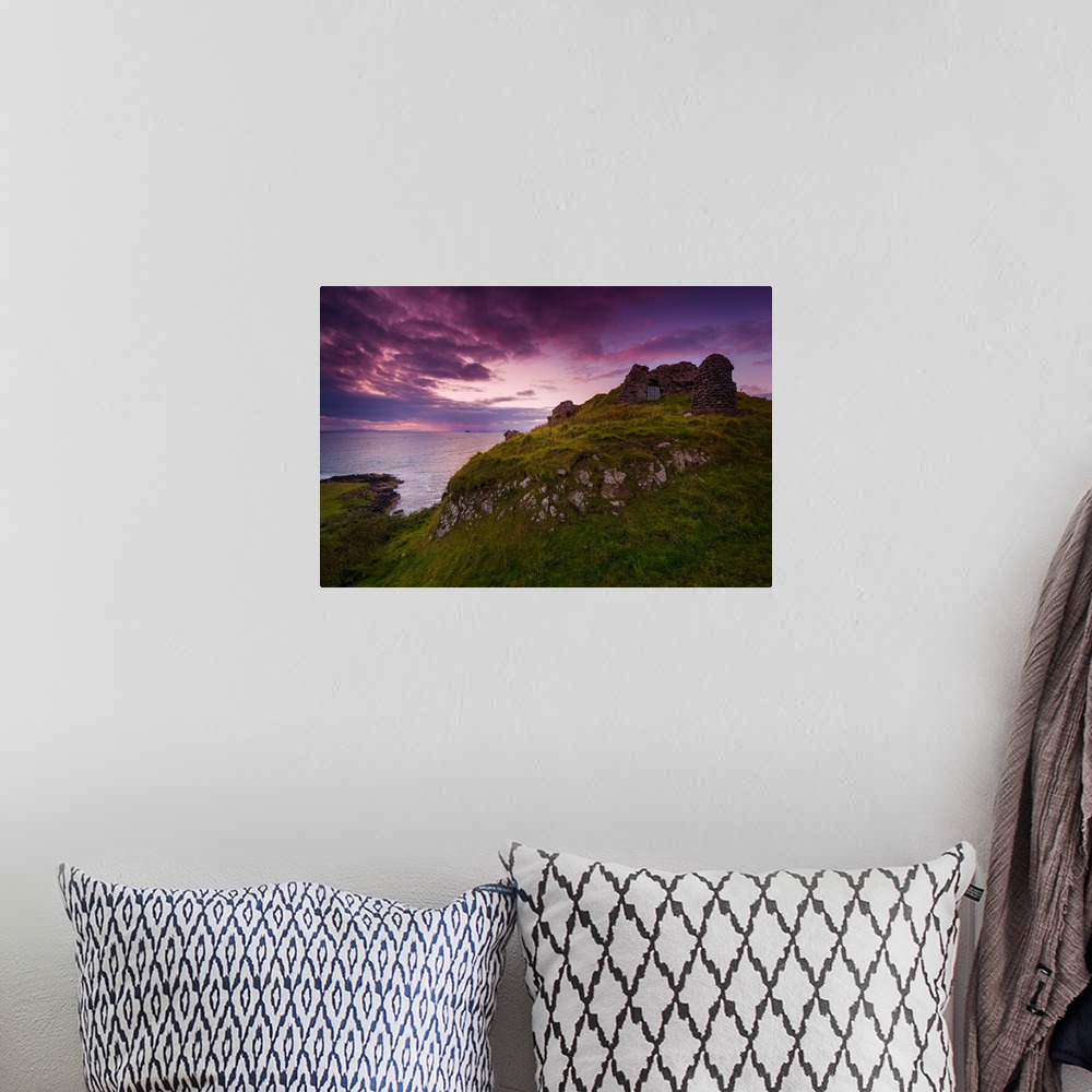 A bohemian room featuring Fine art photo of grassy hills overlooking the sea under a pastel sky at dusk.