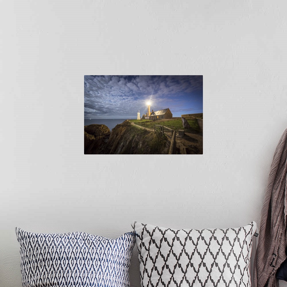 A bohemian room featuring Night shot of Pointe Saint Mathieu lighthouse under the stars.