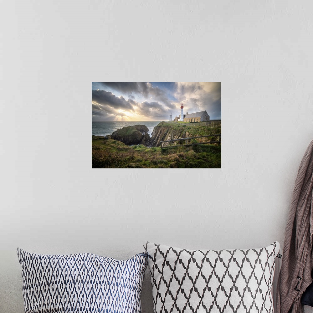 A bohemian room featuring Landscape view of Brittany shoreline called pointe saint mathieu at sunset with rays of light in ...