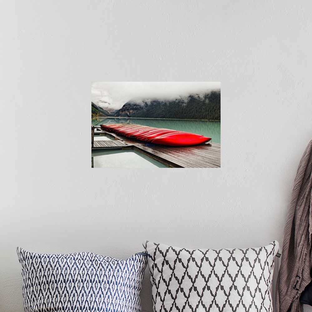A bohemian room featuring Low Angle View of a Dock with Red Boats, Lake Louise, Alberta, Canada