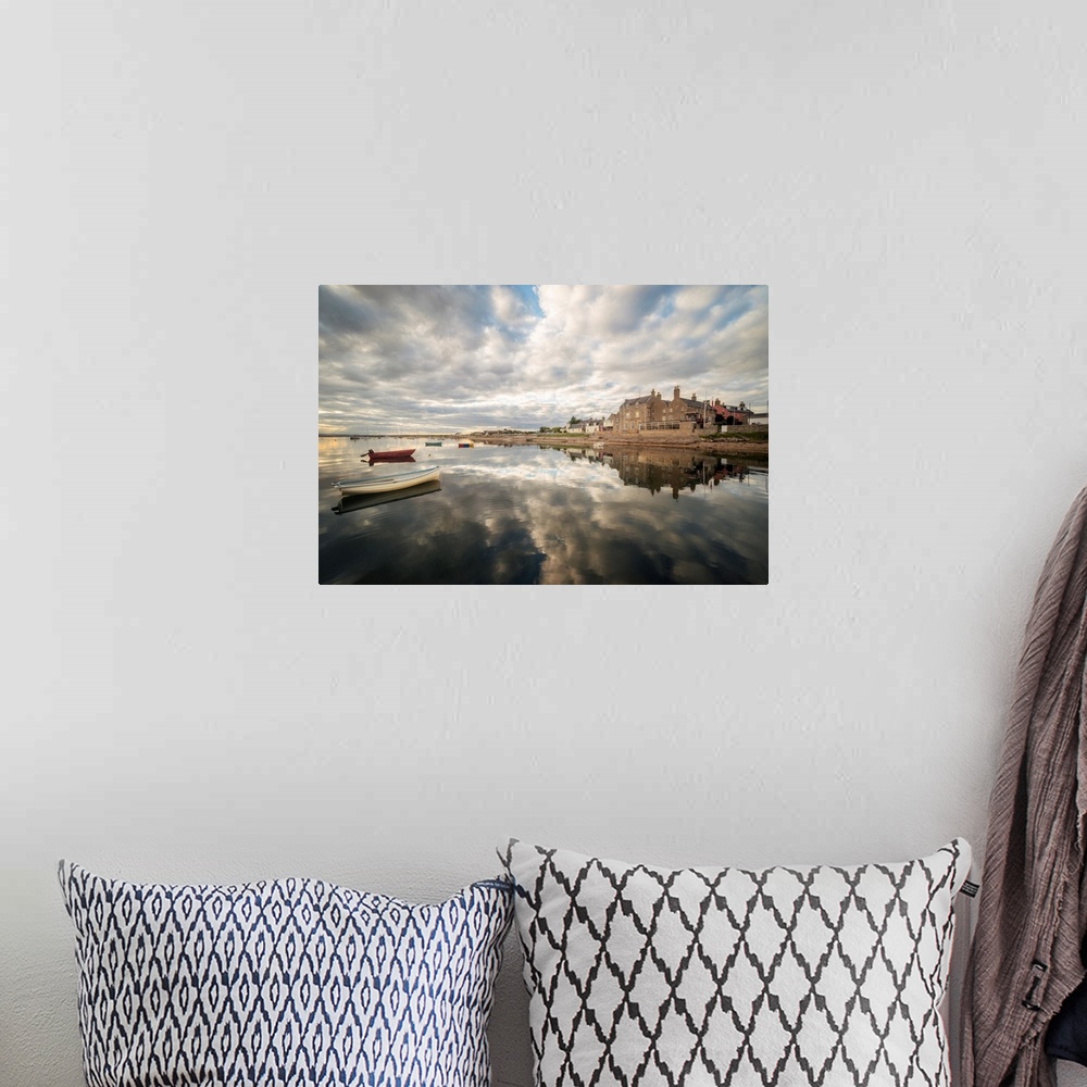 A bohemian room featuring Clouds reflection in the sea on the findhorn coast in scotland
