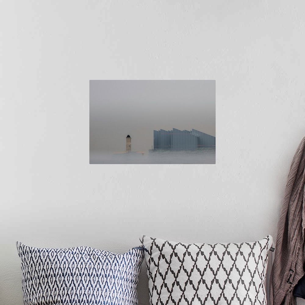 A bohemian room featuring Fine art photograph of a repeated city building on a gray sky with mist at the bottom rising up.