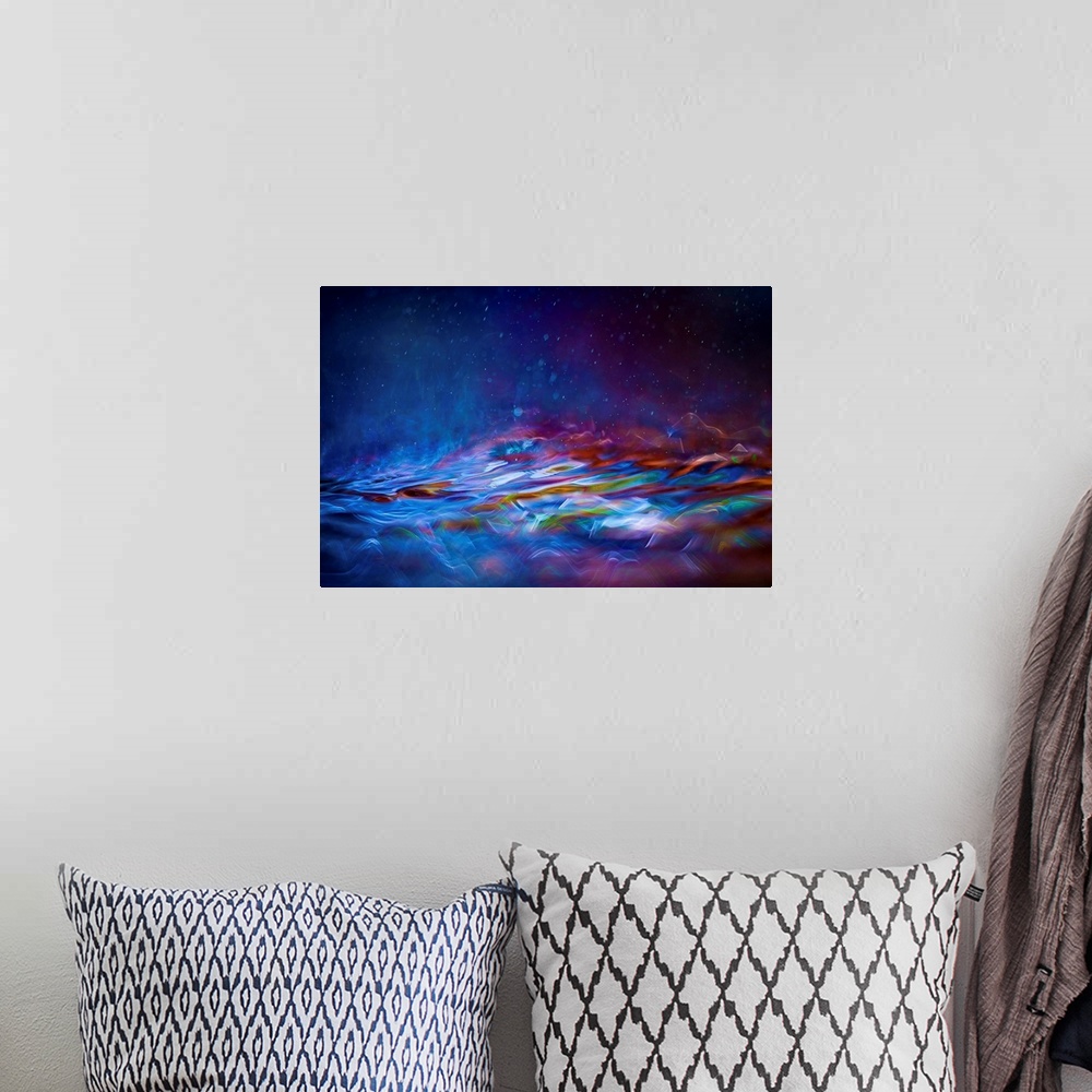 A bohemian room featuring Contemporary abstract painting of colorful waves and mist of soft glowing light.