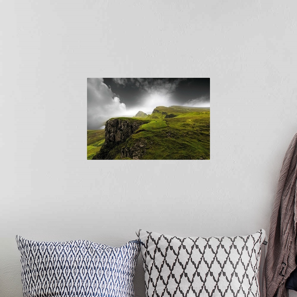 A bohemian room featuring Fine art photo of a misty valley with rocky cliffs.