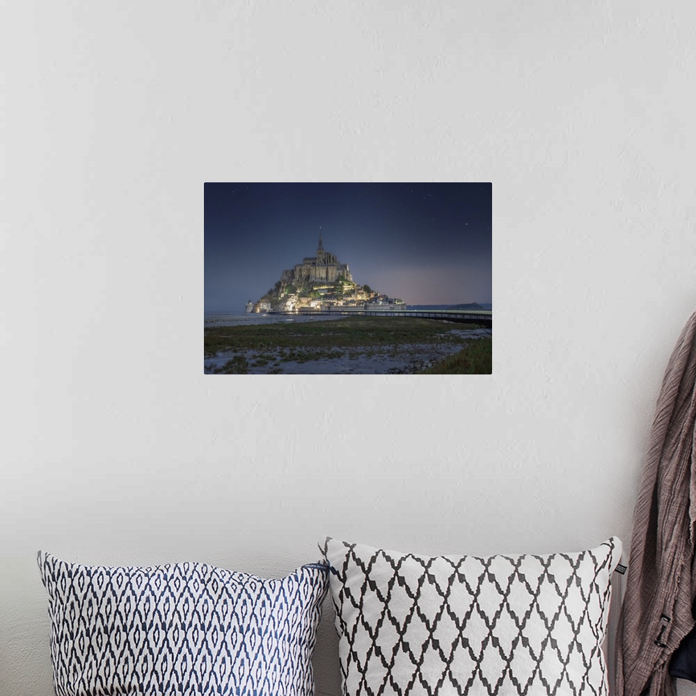 A bohemian room featuring Night shot of Mont Saint Michel in Normandy. France, Europe.