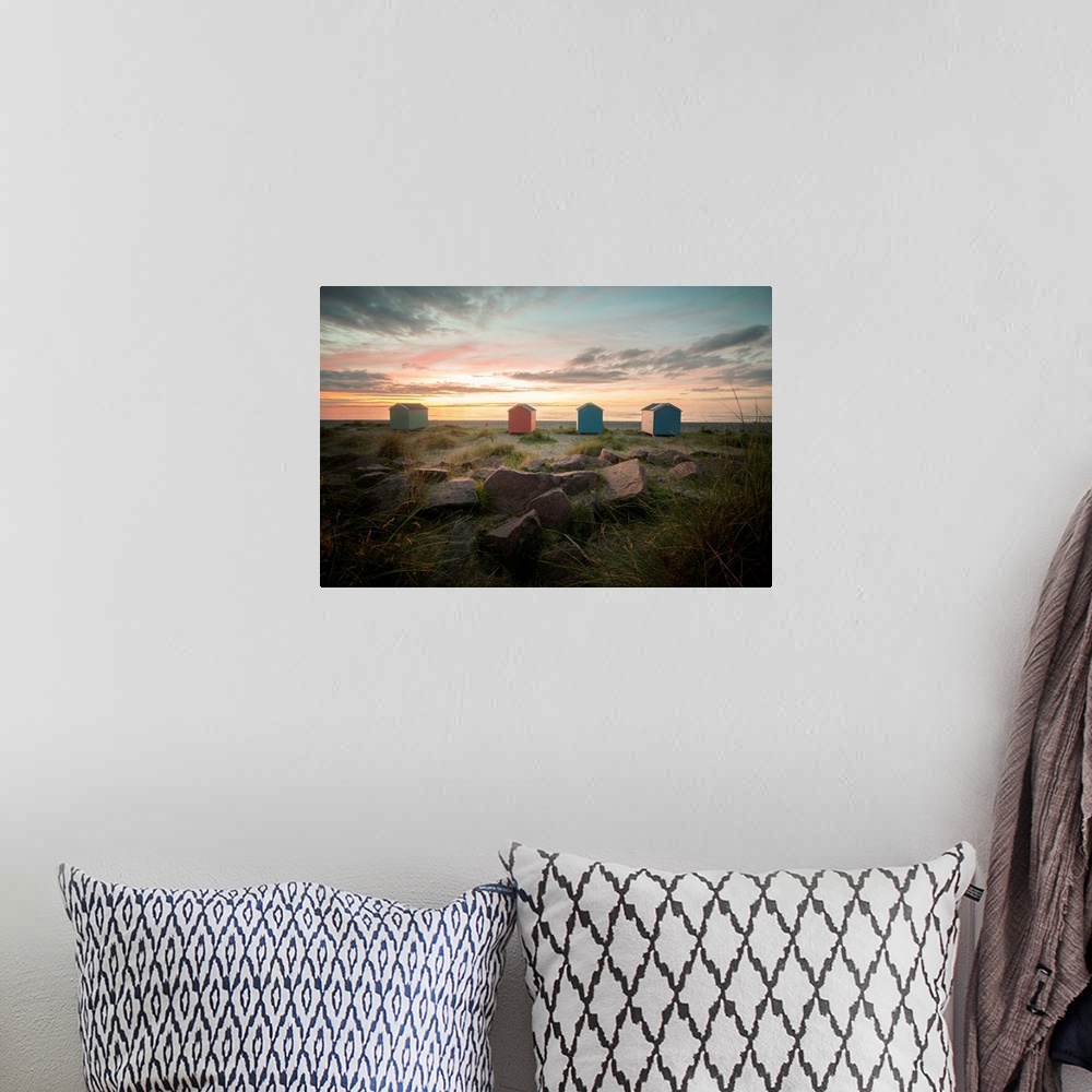A bohemian room featuring A pink and orange sunset in Scotland on findhorn beach