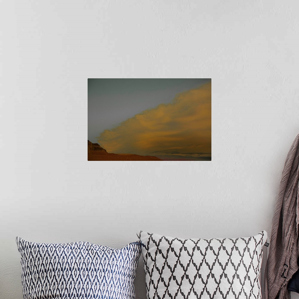 A bohemian room featuring Abstract landscape photograph representing a desert, sand, and a sandstorm.