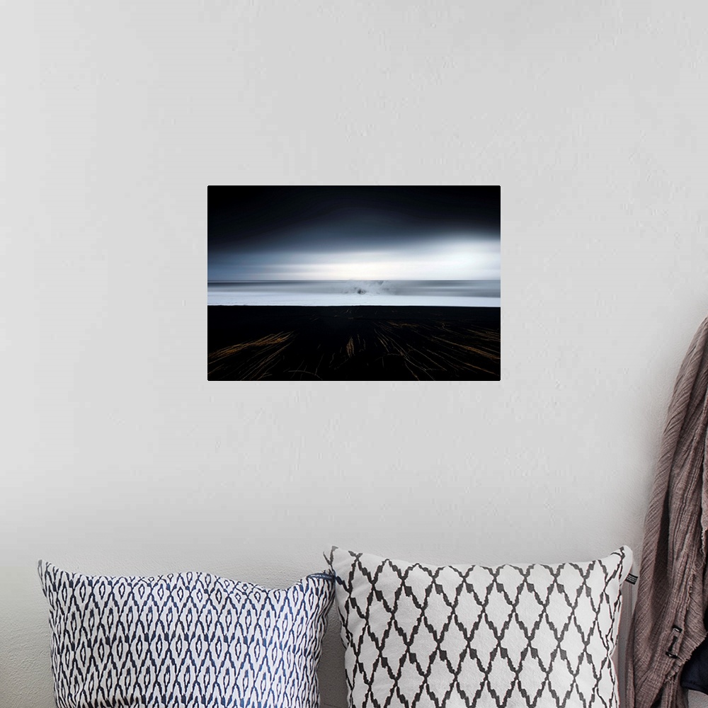 A bohemian room featuring Abstract photograph of a dark landscape with thin gold lines leading up to an ocean where a large...