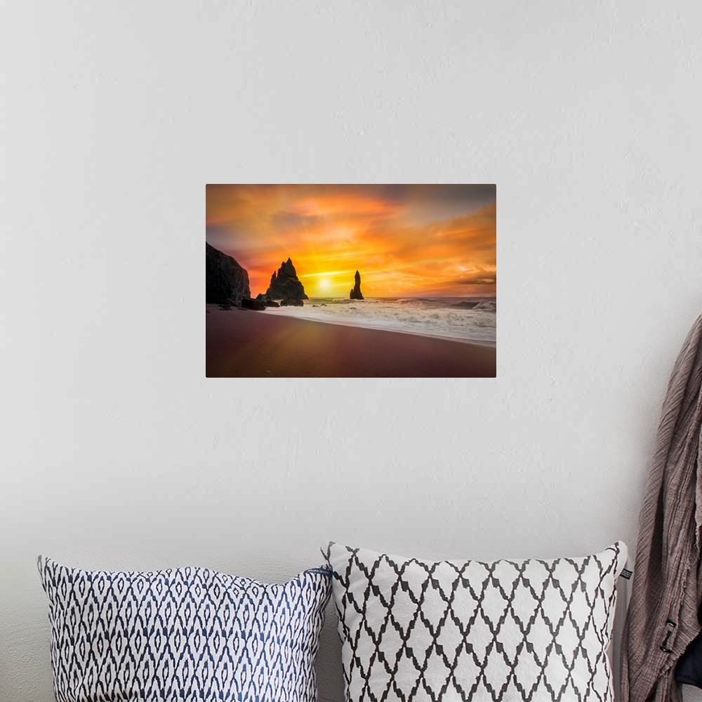 A bohemian room featuring Fine art photograph of the sun shining over a sandy beach with foamy waves.