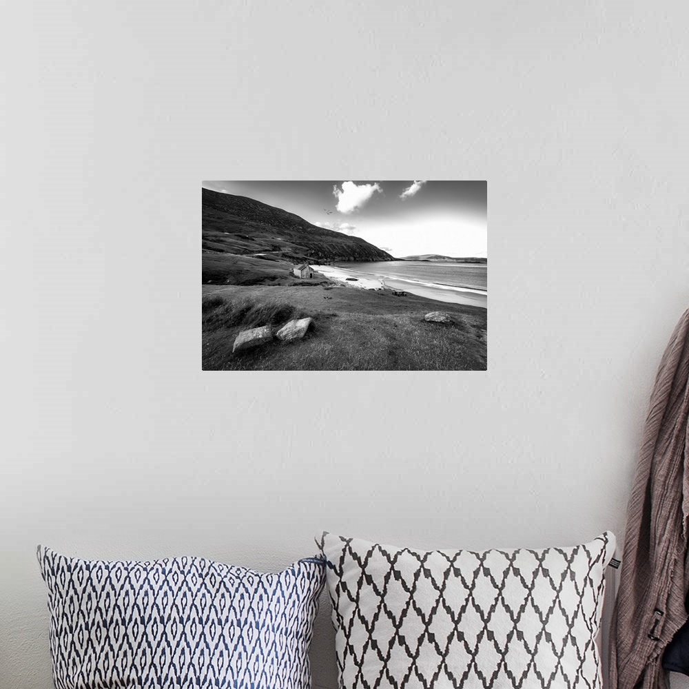 A bohemian room featuring Black and white photo of a beach in Ireland