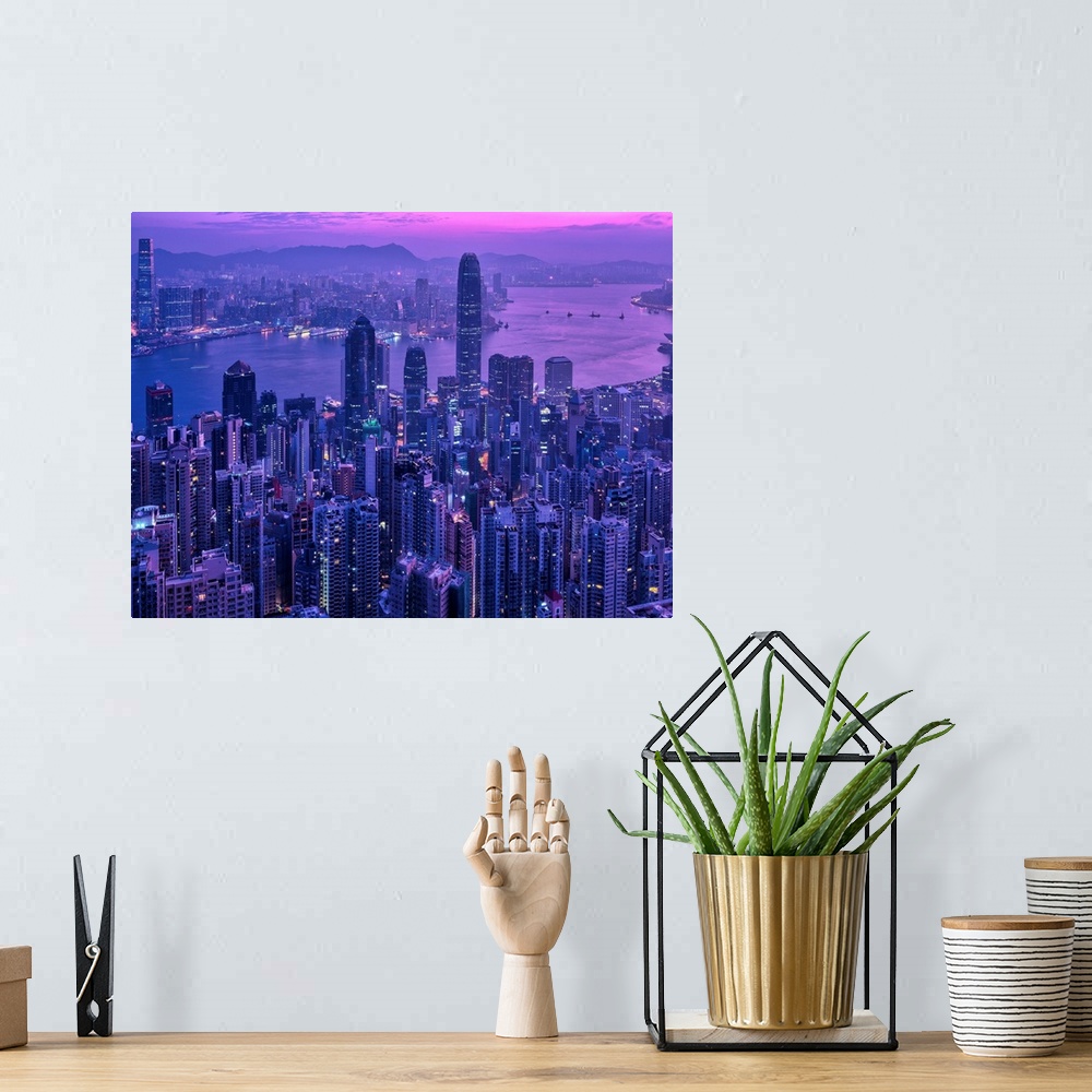 A bohemian room featuring Ariel view of the city of Hong Kong, China at sunset.