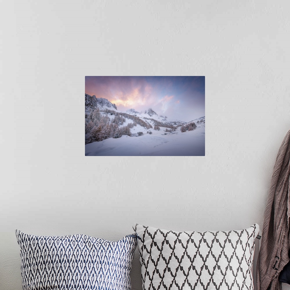 A bohemian room featuring Colored sunset landscape scene on a snowy mountain in the Alpes in France. A pine valley in winte...